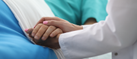 nurse holding hand